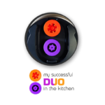 A close-up of a dual system shown with orange and purple inserts labeled as "My successful DUO in the kitchen," symbolizing two-speed settings for kitchen appliances.